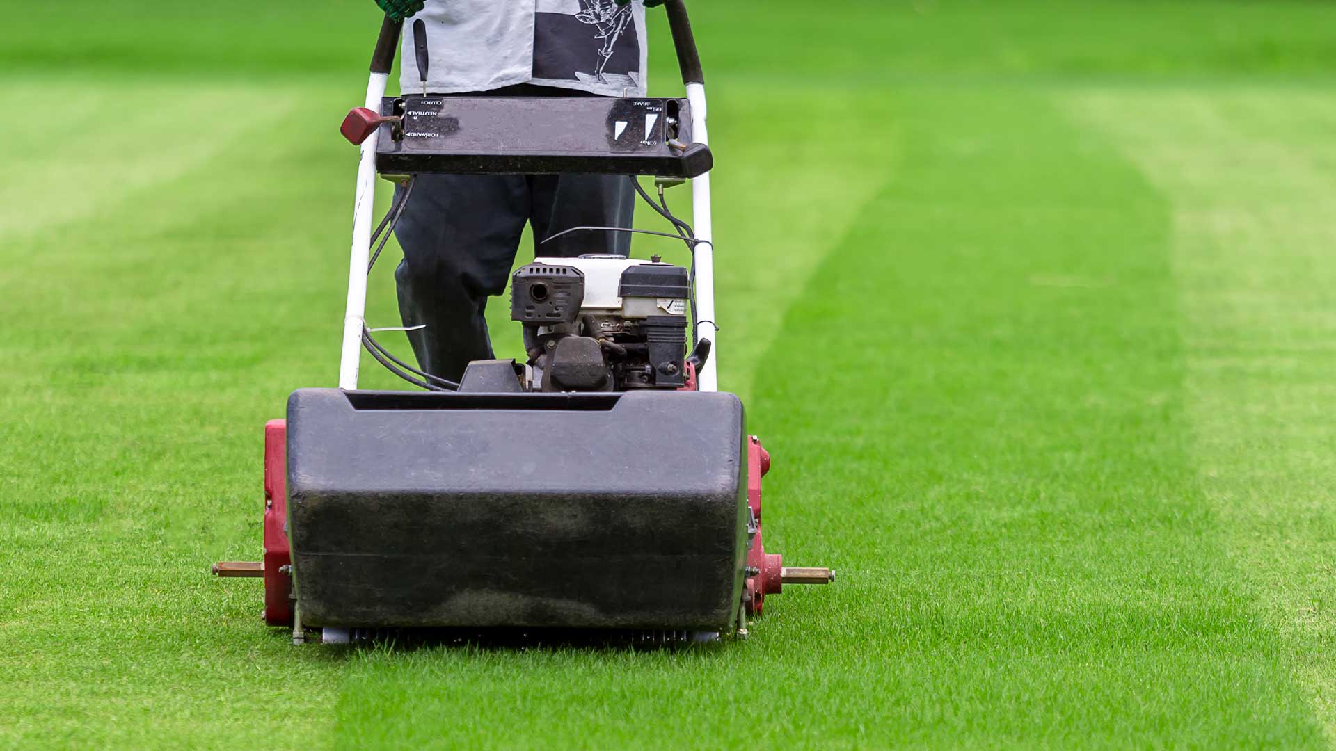 Mowing grass tennis courts