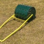 Aerator for grass tennis courts